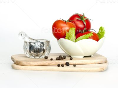Red juicy tomatoes and lettuce leaves