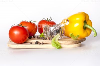 Sweet pepper of yellow color and ripe tomatoes