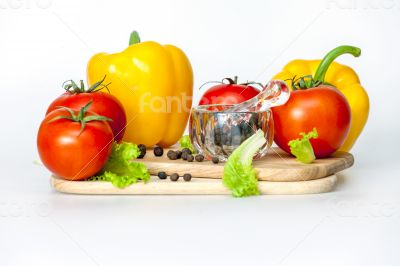 Sweet pepper of yellow color and ripe tomatoes
