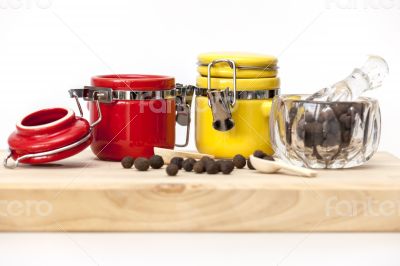 Black pepper and multi-colored containers for spices