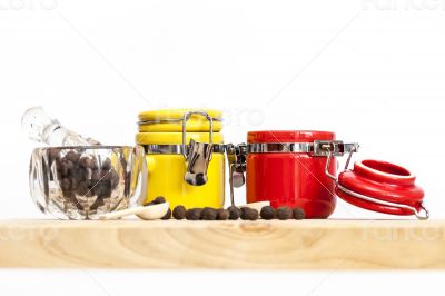 Black pepper and multi-colored containers for spices