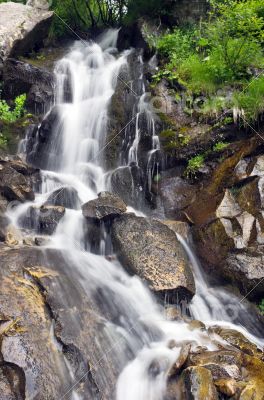 landscape with waterfall in the mountains