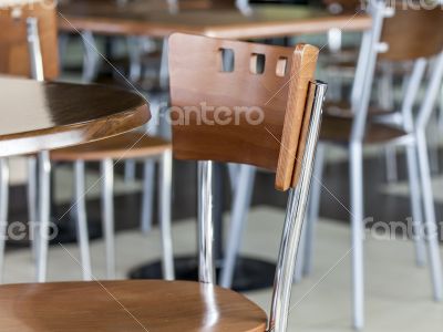 Tables and chairs in cafe in shopping center