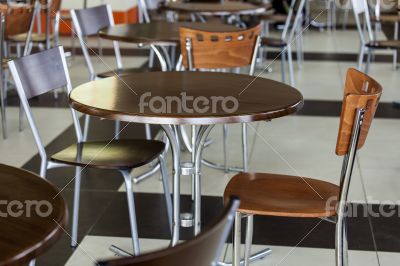 Tables and chairs in cafe in shopping center