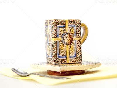 Ceramic coffee cup with a square saucer