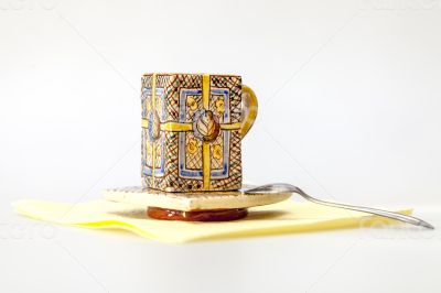 Ceramic coffee cup with a square saucer