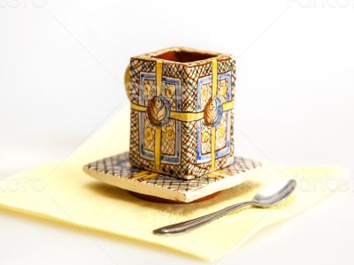 Ceramic coffee cup with a square saucer