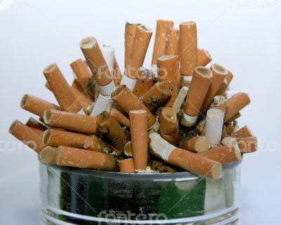 ashtray full with cigarette butt garbage pile