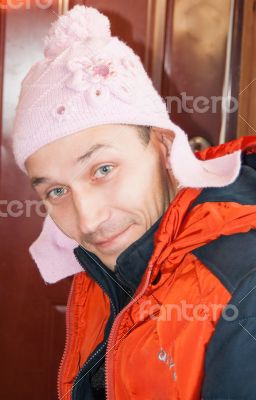 Young man in a childs hat