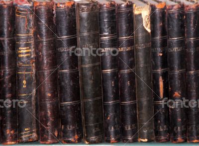 Row of old books cover spines