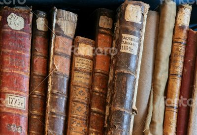 Row of old books cover spines