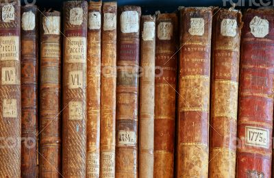 Row of old books cover spines