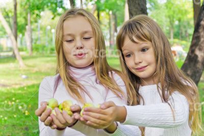 Cute girls with apples