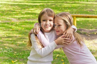 Cute two embracing girls