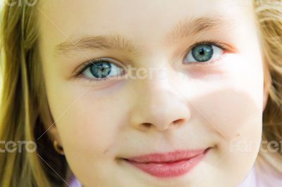 Cute girl with big blue eyes
