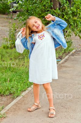 Cute girl playing with white bag