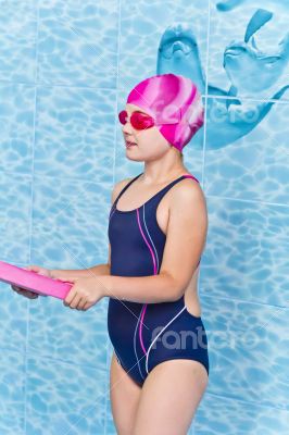 Cute girl in swimming pool
