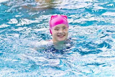 Cute girl in swimming pool