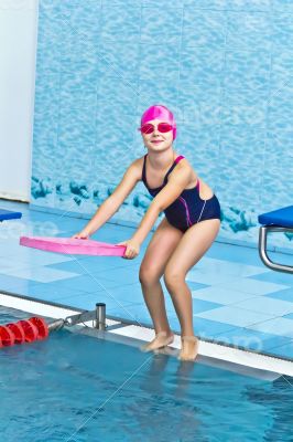 Cute girl in swimming pool