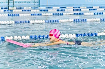 Cute girl in swimming pool