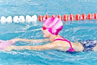 Cute girl in swimming pool