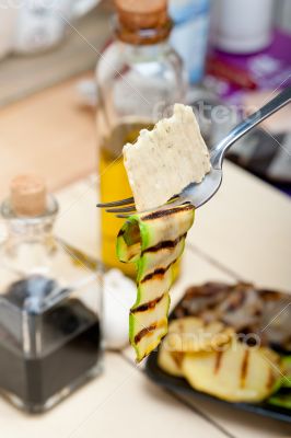 grilled zucchini courgette with cracker on a fork