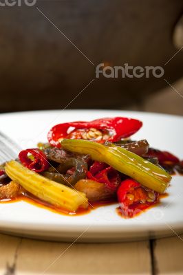 fried chili pepper and vegetable on a wok pan