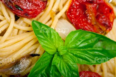 spaghetti pasta with baked cherry tomatoes and basil 