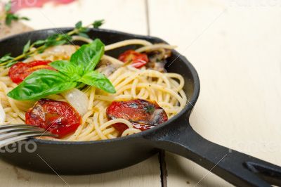 spaghetti pasta with baked cherry tomatoes and basil 