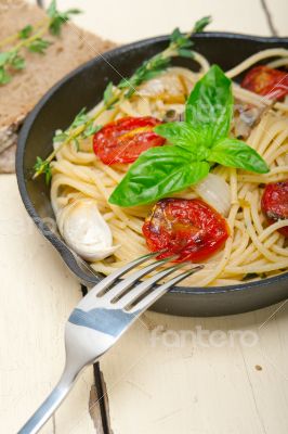 spaghetti pasta with baked cherry tomatoes and basil 