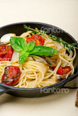 spaghetti pasta with baked cherry tomatoes and basil 