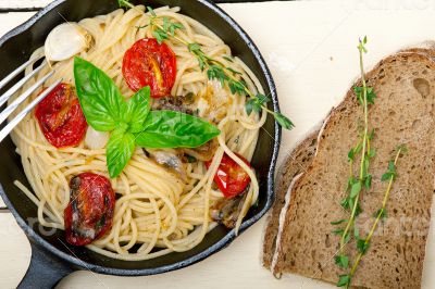 spaghetti pasta with baked cherry tomatoes and basil 