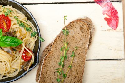 spaghetti pasta with baked cherry tomatoes and basil 