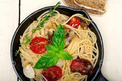spaghetti pasta with baked cherry tomatoes and basil 