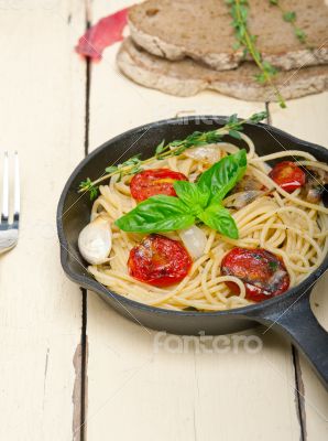 spaghetti pasta with baked cherry tomatoes and basil 