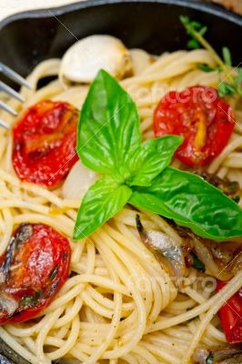 spaghetti pasta with baked cherry tomatoes and basil 