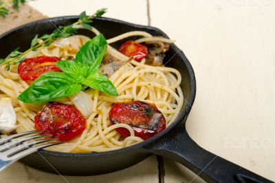 spaghetti pasta with baked cherry tomatoes and basil 