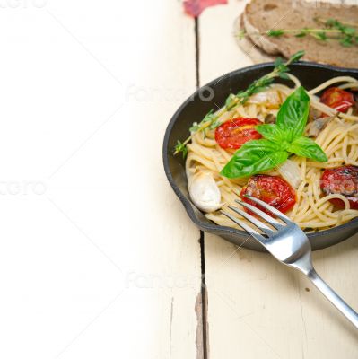 spaghetti pasta with baked cherry tomatoes and basil 