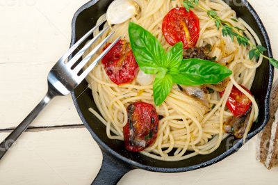 spaghetti pasta with baked cherry tomatoes and basil 