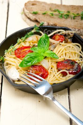spaghetti pasta with baked cherry tomatoes and basil 