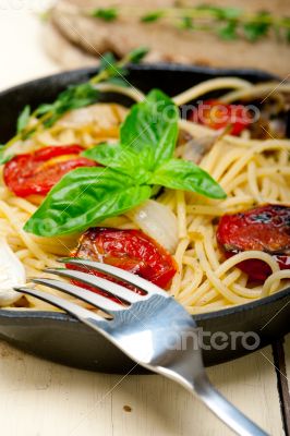 spaghetti pasta with baked cherry tomatoes and basil 