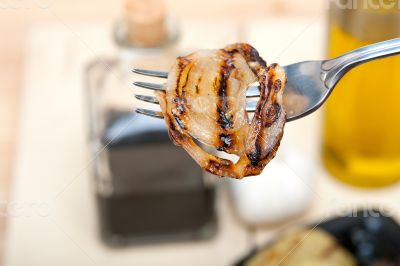 grilled onion on a fork