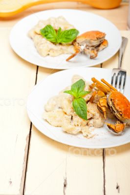 Italian gnocchi with seafood sauce with crab and basil