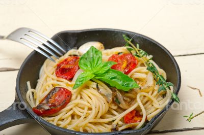 spaghetti pasta with baked cherry tomatoes and basil 