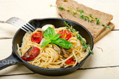 spaghetti pasta with baked cherry tomatoes and basil 