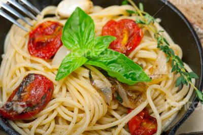 spaghetti pasta with baked cherry tomatoes and basil 