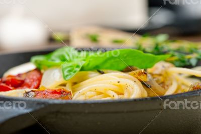 spaghetti pasta with baked cherry tomatoes and basil 