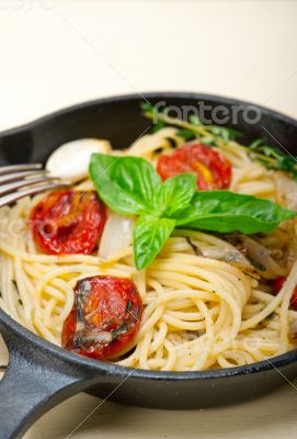spaghetti pasta with baked cherry tomatoes and basil 