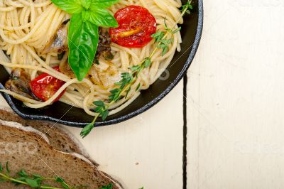 spaghetti pasta with baked cherry tomatoes and basil 