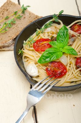 spaghetti pasta with baked cherry tomatoes and basil 